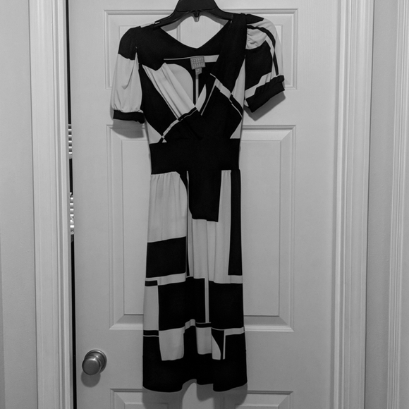 Black and cream knee length dress
